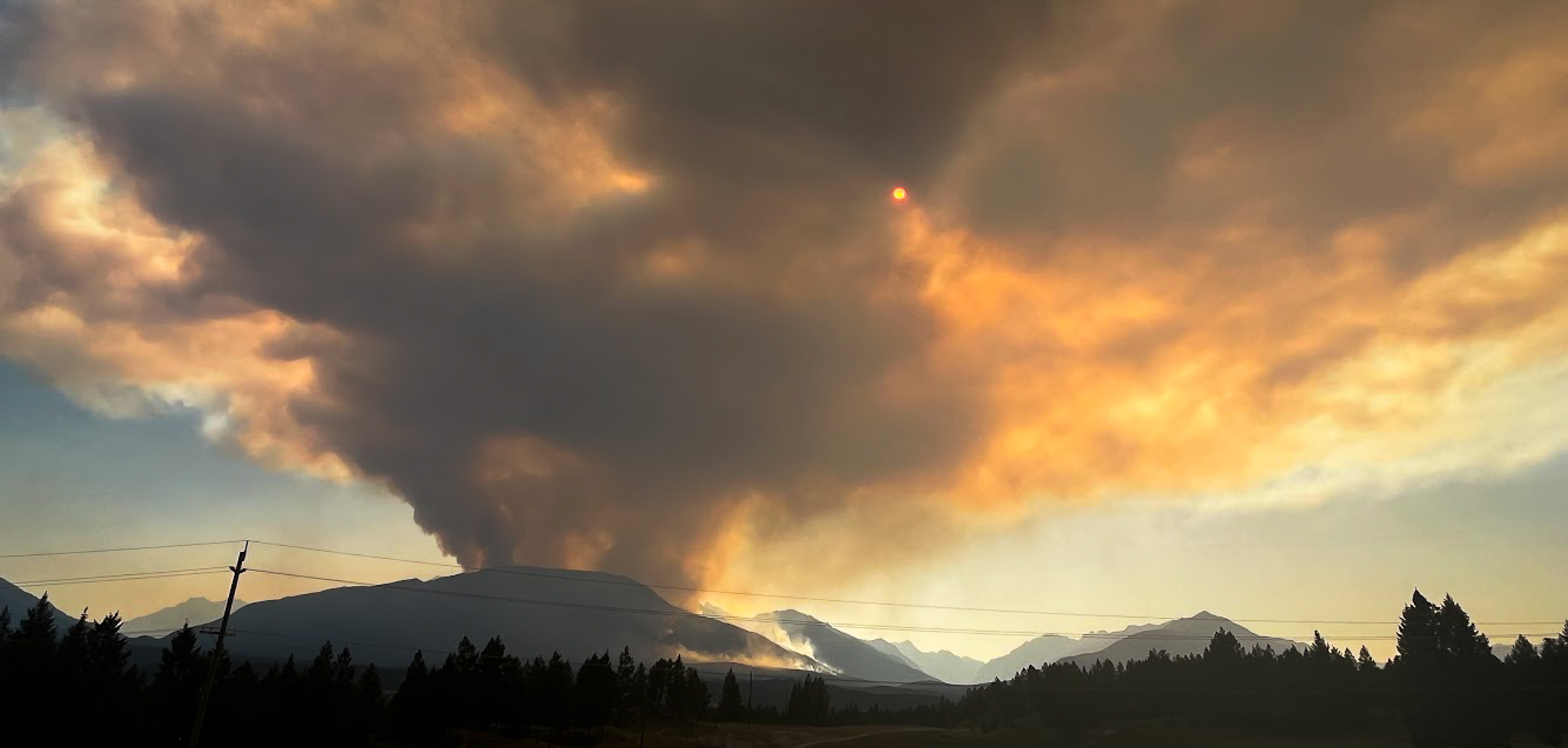 Smoke rising above mountains during wildfires in B.C.