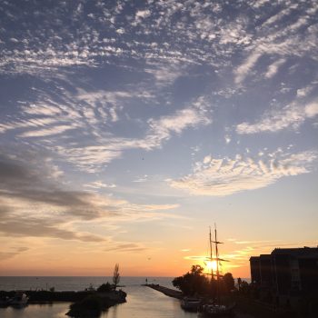 Beautiful Lake Huron sunset overlooking the Kincardine harbour with the tall ships.