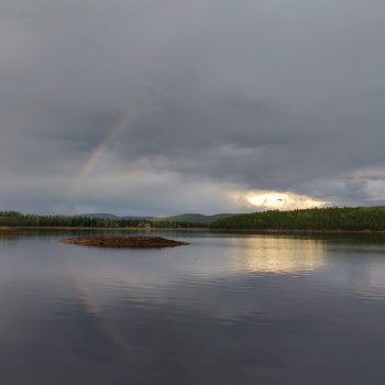 Hydraulic Lake looking out from the Scout camp at a rainbow after a thunderstorm rolls through.