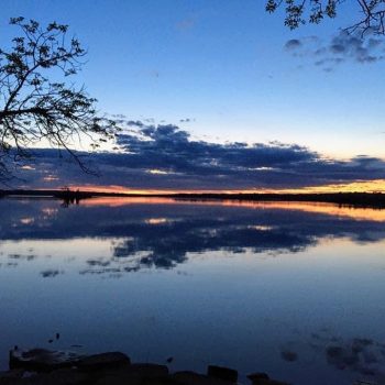 A beautiful summer evening sunset made for a mesmerizing reflection at Otter Falls, Manitoba.