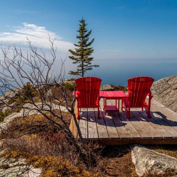 Such a peaceful moment and time for reflection with Parks Canada red chairs.