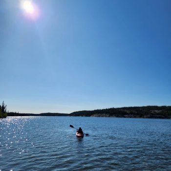 Kayaking at this beautiful calm lake.