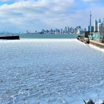 Frozen Lake Ontario at Toronto Waterfront in winter. View from the Toronto Islands.