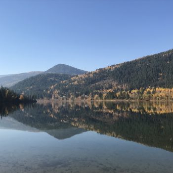 A beautiful fall day, still water and no wind, is providing for a beautiful mirror image reflection.