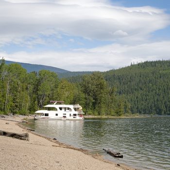 People enjoying their houseboat, in Shuswap Lake Marine Provincial Park - Albas Falls Site.