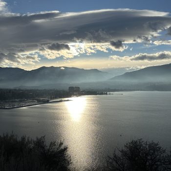 Sun rays breaking through the clouds over Okanagan Lake.