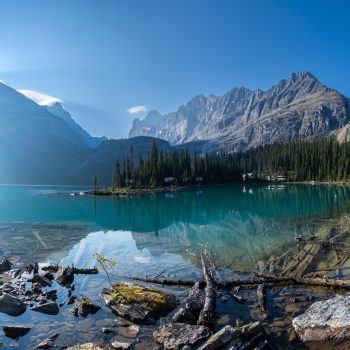 Early morning at Lake O'Hara, with its crystal clear water and the sun rising fast from behind the Rocky Mountains. Lake O'Hara region has sensitive alpine conditions and is carefully protected to kee ...