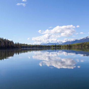 This photo was taken in June 2024 while I was kayaking on Pyramid Lake, Alberta. The wind picked up shortly after this was taken and the glass look was replaced with soft waves.