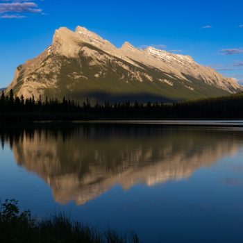 Mountain and forest reflection at Vermilion Lake 2 during golden hour.
Light and shadow play on the mountain and forest. The lake is at peace, but alive with color.