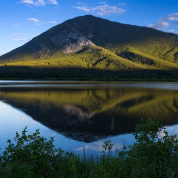 Mountain reflection at Vermilion Lakes near sunset.

Air was still, the water was still, clear blue sky.