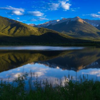 Mountain and forest reflections in Vermilion Lake, Banff National Park.