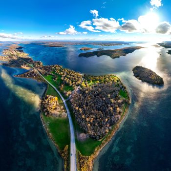 This is an aerial photo of the Long Sault Parkway, an island chain linked by a road in the Lake St. Lawrence, which formed after the construction of the Moses Saunders Dam in 1958. The building of the ...