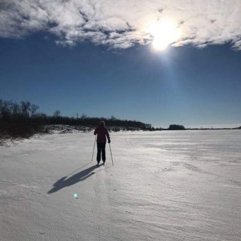 Cross Country skiing in December 2021 on frozen Anderson Lake. The lake offers unlimited winter entertainment to anyone with a set of cross country skis, snowshoes or a snow mobile.